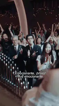 Audience applauds singer on stage