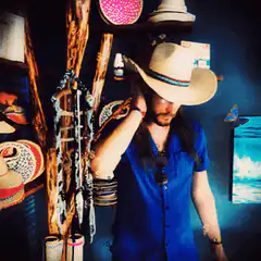Man in cowboy hat with glowing eyes
