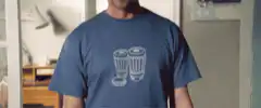 Simon Pegg screaming in a blue t-shirt