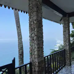Stone pillars on a balcony overlooking the ocean