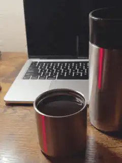 coffee and laptop on desk