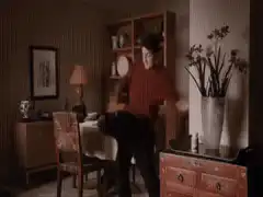 man dancing with dog in dining room