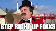 Circus ringmaster shouting through megaphone