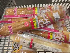 packaged baguettes in shopping basket