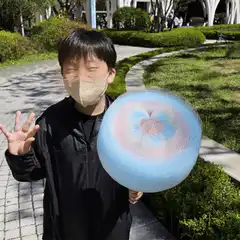 Boy holding Bitcoin orb with glowing eyes