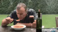 Man eating soup in the rain