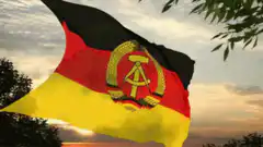 East German flag waving at sunset