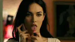 Megan Fox licks lighter flame