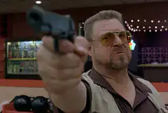 John Goodman pointing gun
