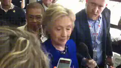 Hillary Clinton looking at her phone