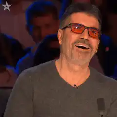 Simon Cowell laughing then shocked
