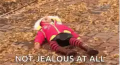 Toddler lying in leaves not jealous