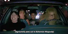 Friends jamming to Bohemian Rhapsody in car
