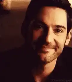 Tom Ellis smirking