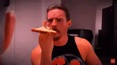 Man eating bread with nose