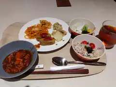 Japanese school lunch tray with curry, pasta, and salad
