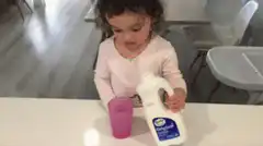 Toddler spills milk everywhere