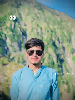 Man with googly eyes on mountain