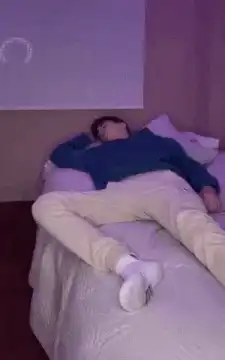 man wakes up startled in bed