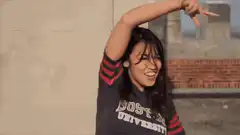 Woman dancing and flipping hair