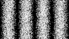 falling white particles on black background