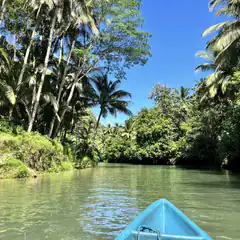 Blue boat on tropical river
