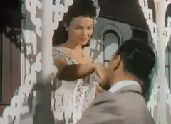 Woman kisses man's hand