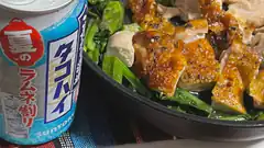 Grilled chicken and greens with a can of Suntory Takao beer