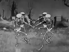 Four skeletons dancing in a circle