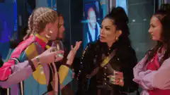 Three women talking at a party