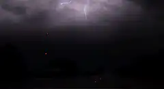 massive lightning storm over rural road