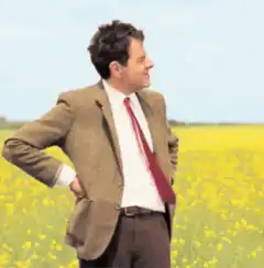 Mr. Bean in a field of yellow flowers