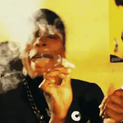Man smoking and blowing smoke rings