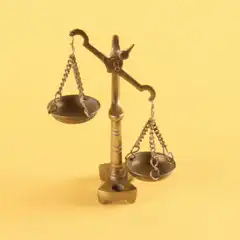 Brass scale tipping back and forth