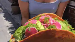 woman holding giant taco