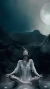 Woman meditating under full moon