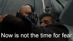 Bane throws Batman off a helicopter