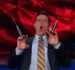 Stephen Colbert holding syringes