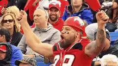 Buffalo Bills fan throws red confetti