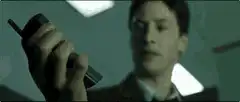 Keanu Reeves holding a phone