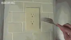 Fork scoops cake out of electrical outlet