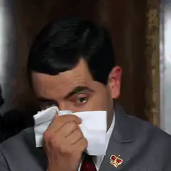 Mr. Bean blows nose with tissue