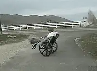 Person in wheelchair spinning in circles