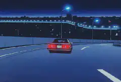 DeLorean driving on highway at night