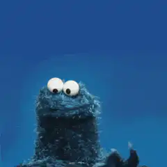 Cookie Monster holding a Bitaxe