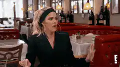 Khloe Kardashian talking in a restaurant