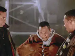 Three men laughing and hugging
