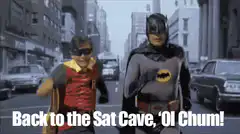 Batman and Robin walking down city street