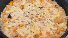 creamy risotto with melted cheese and vegetables