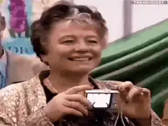 Old lady takes photo with flash